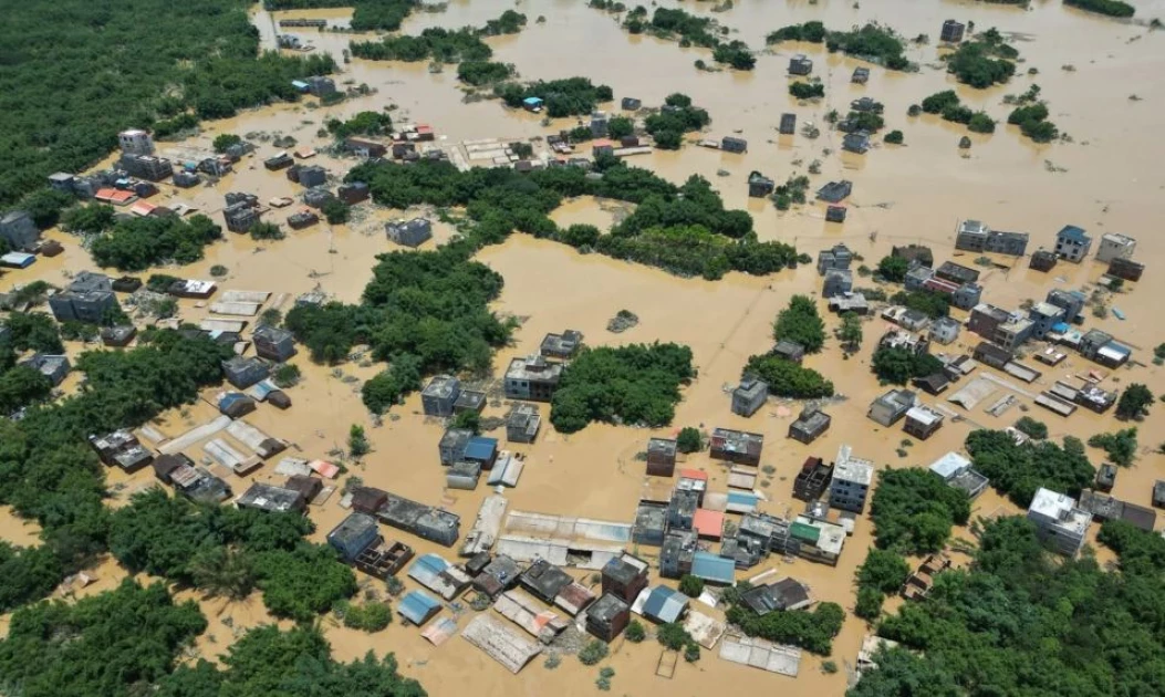 Record floods threaten Southern China