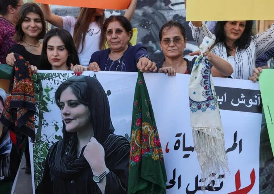 Iran's Revolutionary Guards issue warning as protests over woman's death spread