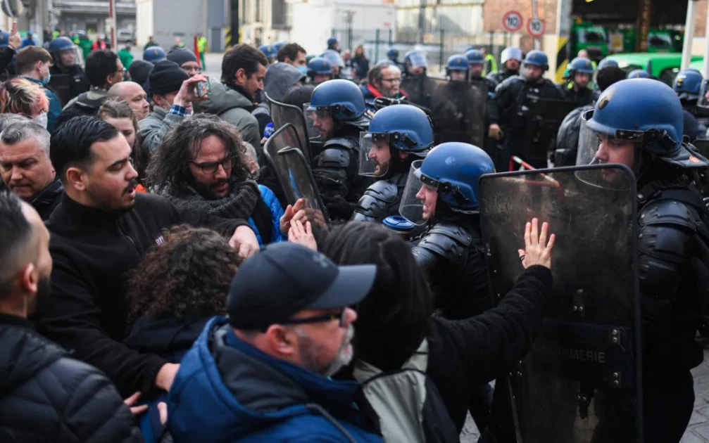 Hundreds detained in fiery protests after French government forces through higher retirement age   